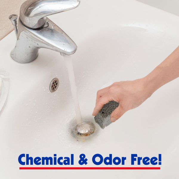 pumie heavy duty scouring stick rust stain remover being used to remove a ring of rust in a bathroom sink